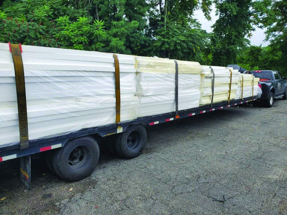 Rigid polystyrene insulation panels loaded for delivery.